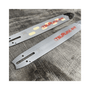 Tsumura Light Type Chainsaw Bar 18" on a wooden surface, showcasing its precision design for professional tree surgeons.