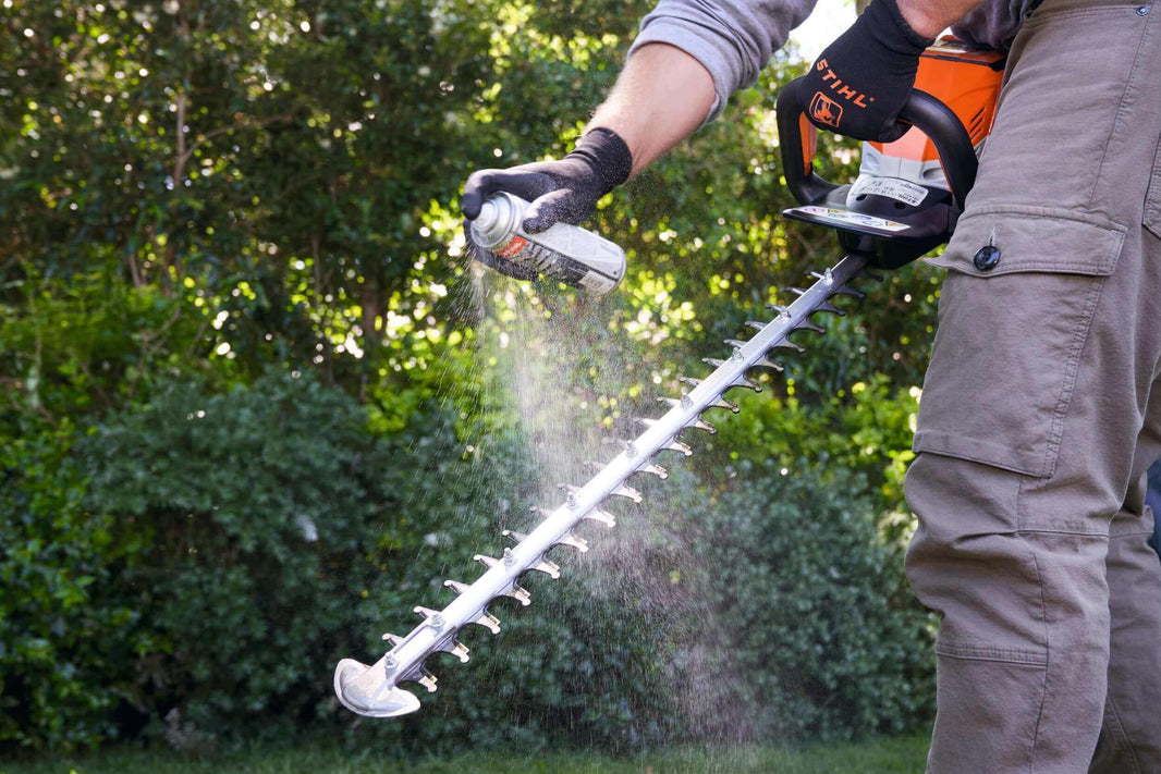 Cleaning garden tools with a spray can in The Ultimate Guide to Garden Tool Cleaning.
