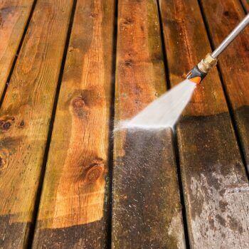 Pressure Washing Tips: How to Use a Pressure Washer - cleaning wooden deck with pressure washer