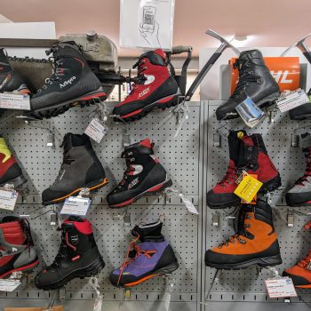 Unveiling the Best Classes of Chainsaw Boots: A Comprehensive Guide - display of various chainsaw boots in a shop.