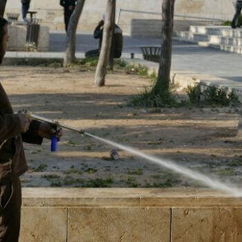 Everything You Need To Know About Stihl Pressure Washers in action, showcasing a user cleaning a surface outdoors.