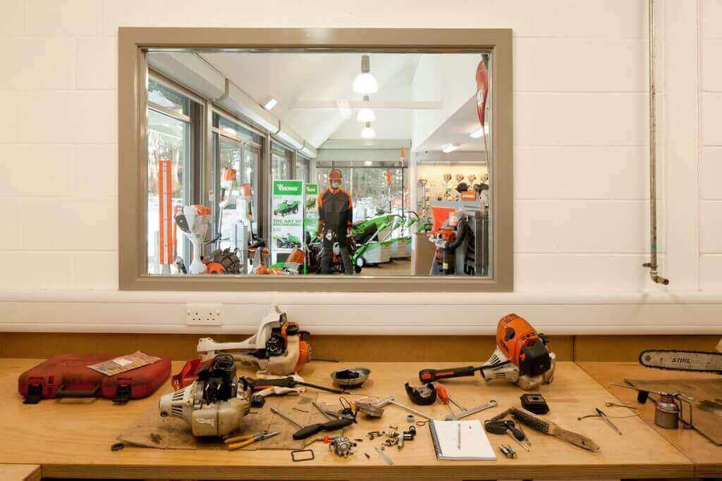 Genuine STIHL Parts Delivered Globally, Hassle-Free! - Tool repair and maintenance area with parts and accessories.