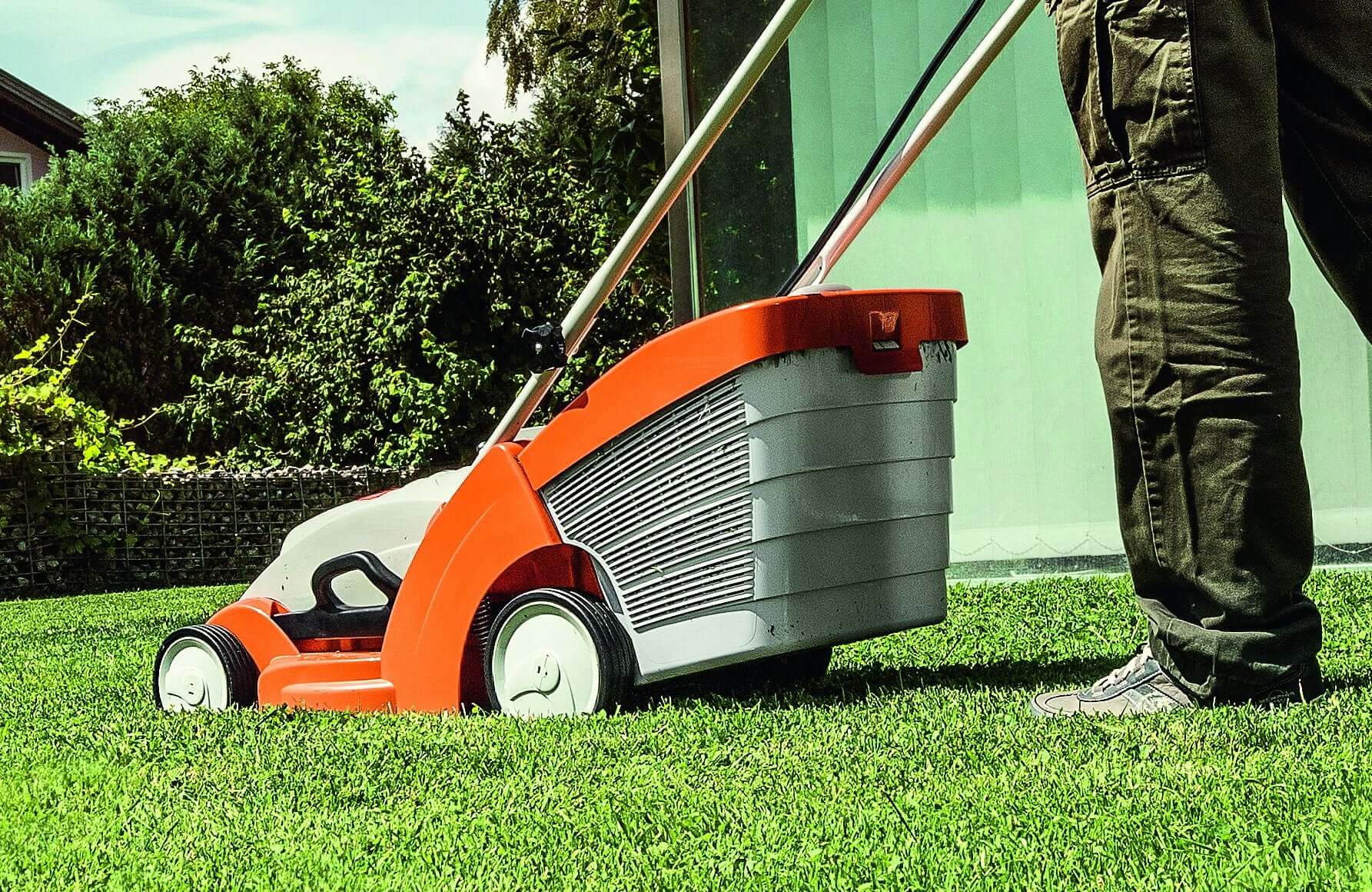 STIHL electric lawnmower in action on a lawn, perfect for gardeners and tree surgeons.
