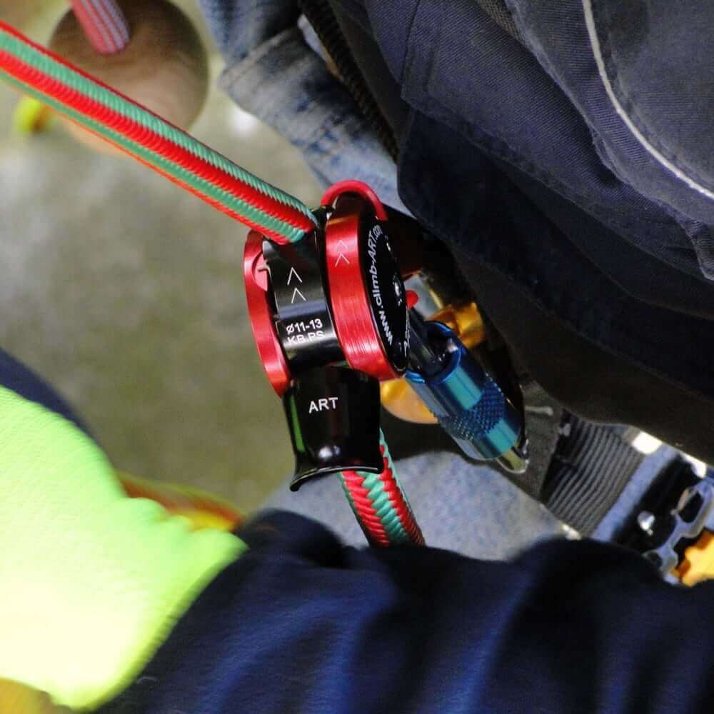 Close-up of ART Positioner adjusting climbing rope, essential for tree surgeons and rigorous climbing applications.