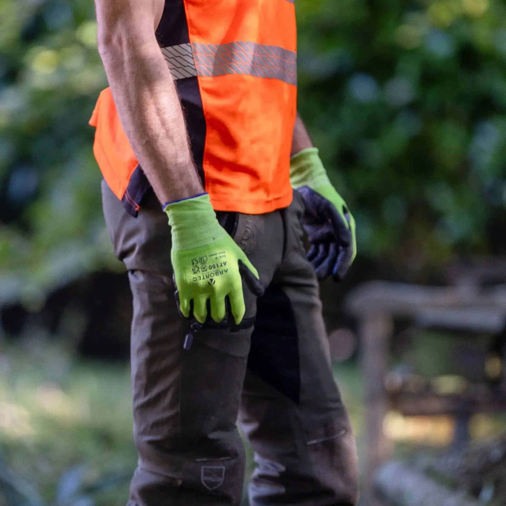 Climbing Gloves for Arborists & Professional Tree Work worn by an arborist in a safety vest.