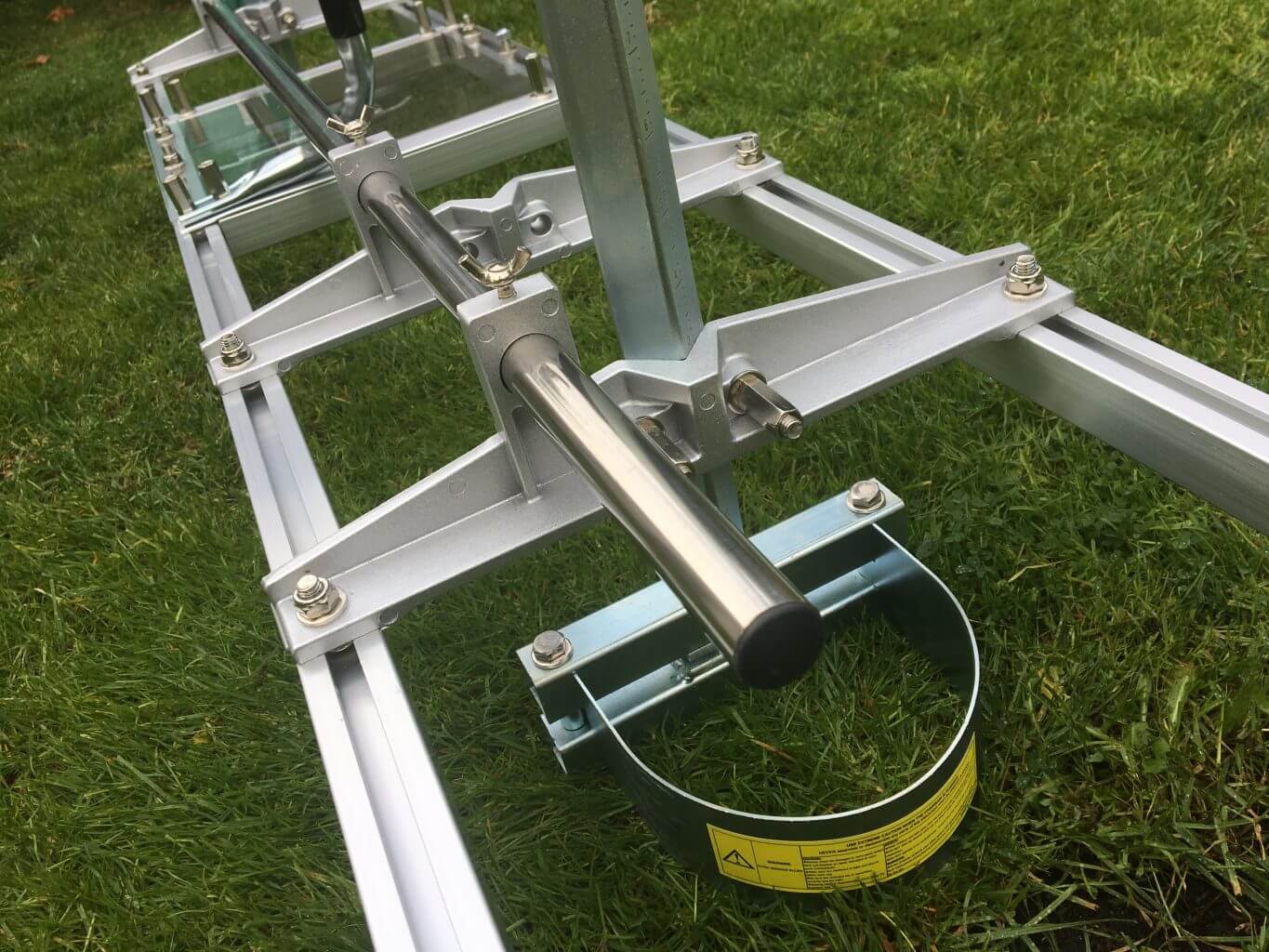 Ecomill chainsaw mill component on grass, designed for tree surgeons to create lumber from logs.