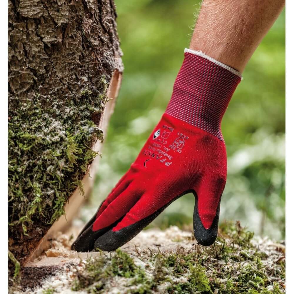 Close-up of a Pfanner work glove being used by a tree surgeon, showcasing quality and performance in forestry.