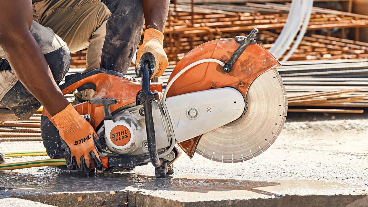 STIHL cut-off saw in use, ideal for cutting concrete and metal, essential tool for tree surgeons and construction workers.