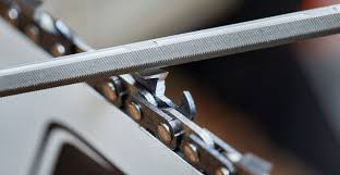 Close-up of sharpening a STIHL hexagonal chainsaw chain, ideal for tree surgeons and fast cutting performance.