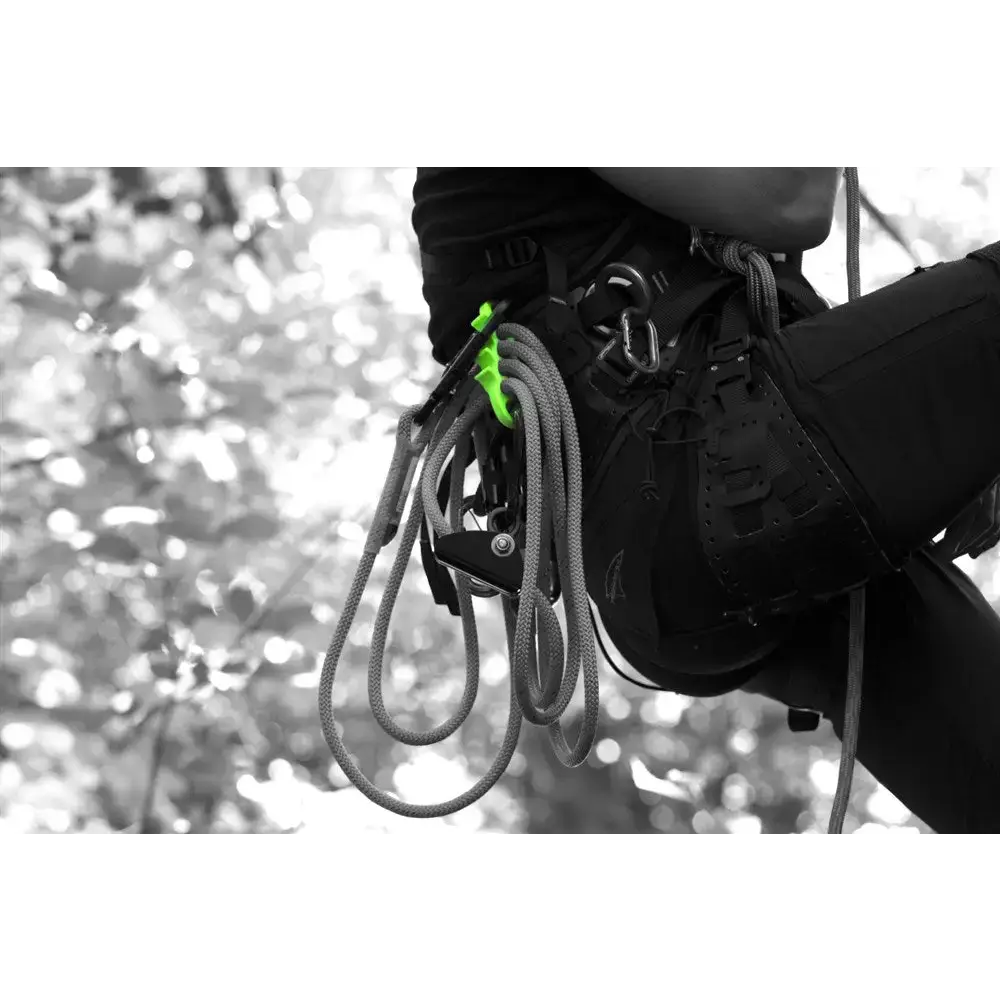 Tree surgeon using fliplines and accessories for safe tree climbing and arborist tasks.