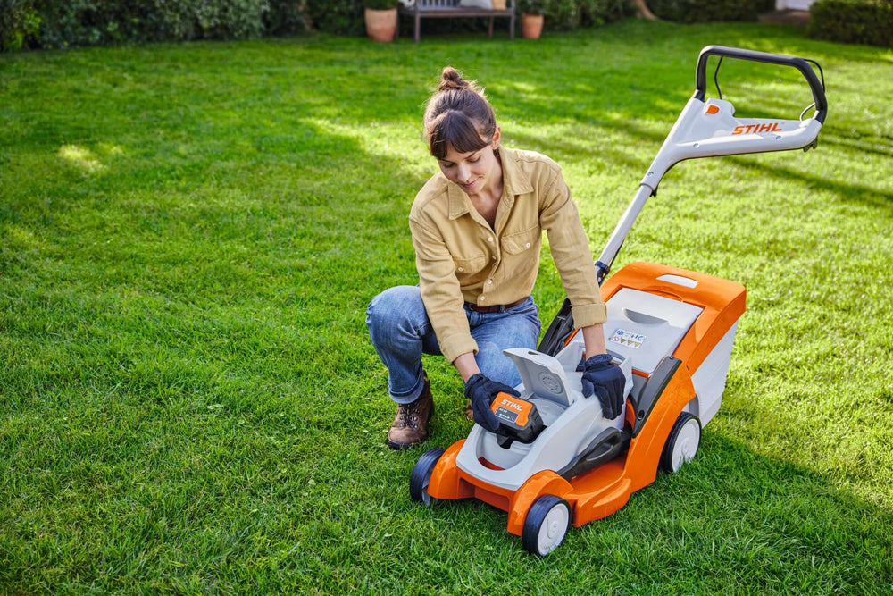 STIHL RMA 239 C Cordless Lawnmower in use, perfect for small to medium-sized gardens.