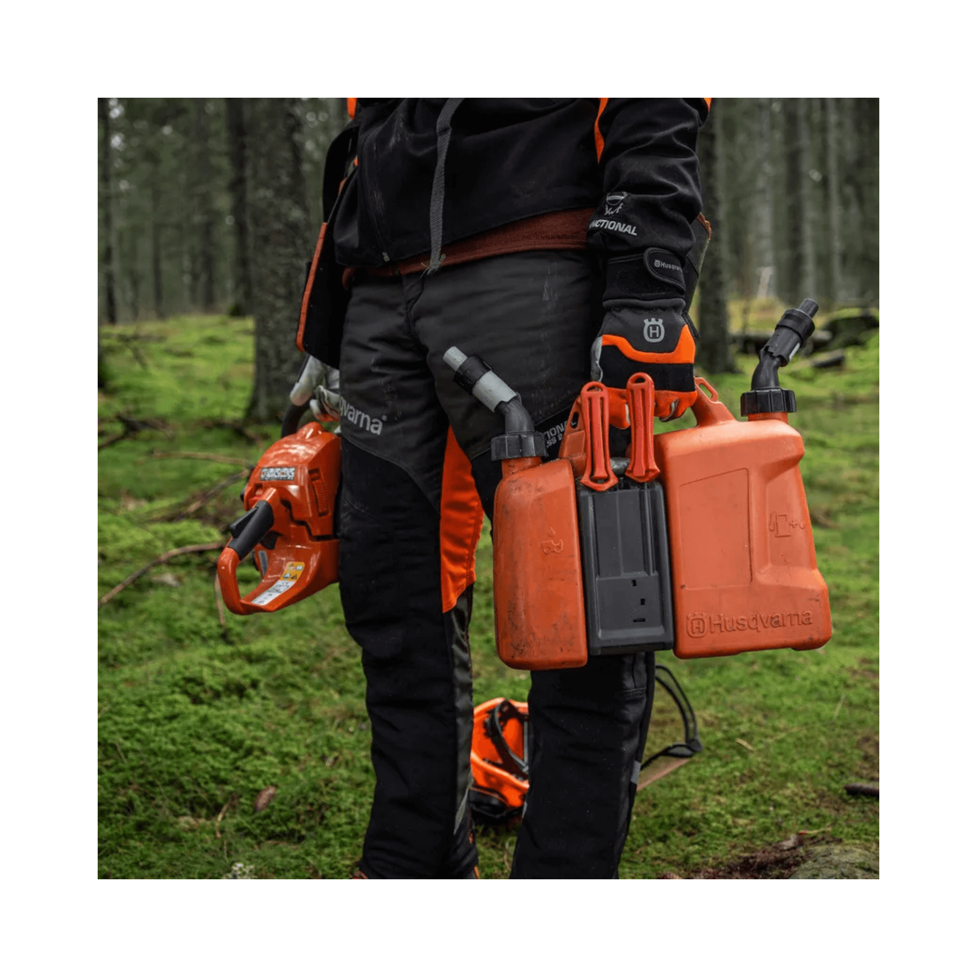 Husqvarna Combination Can held by an arborist in a forest, designed for efficient chainsaw refuelling.
