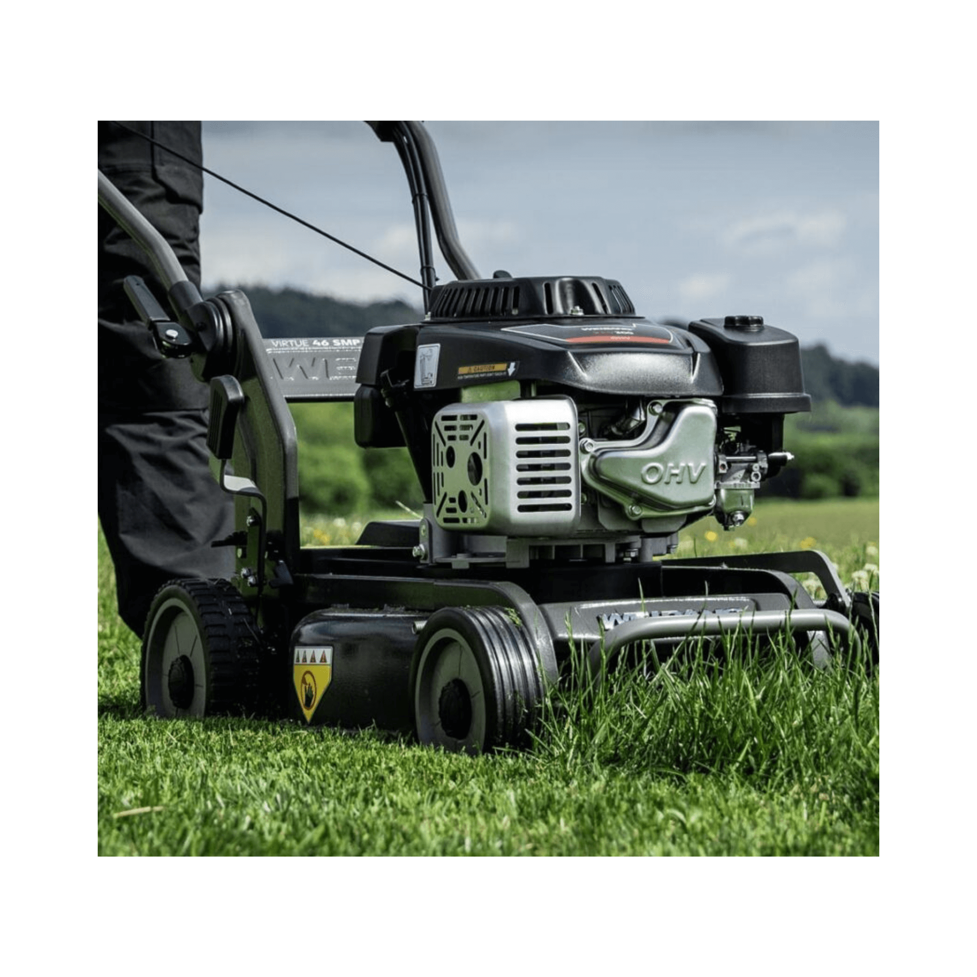 Virtue 46 SMP LV Petrol Mulcher Lawnmower in action on lush grass, showcasing its powerful engine and mulching capabilities.