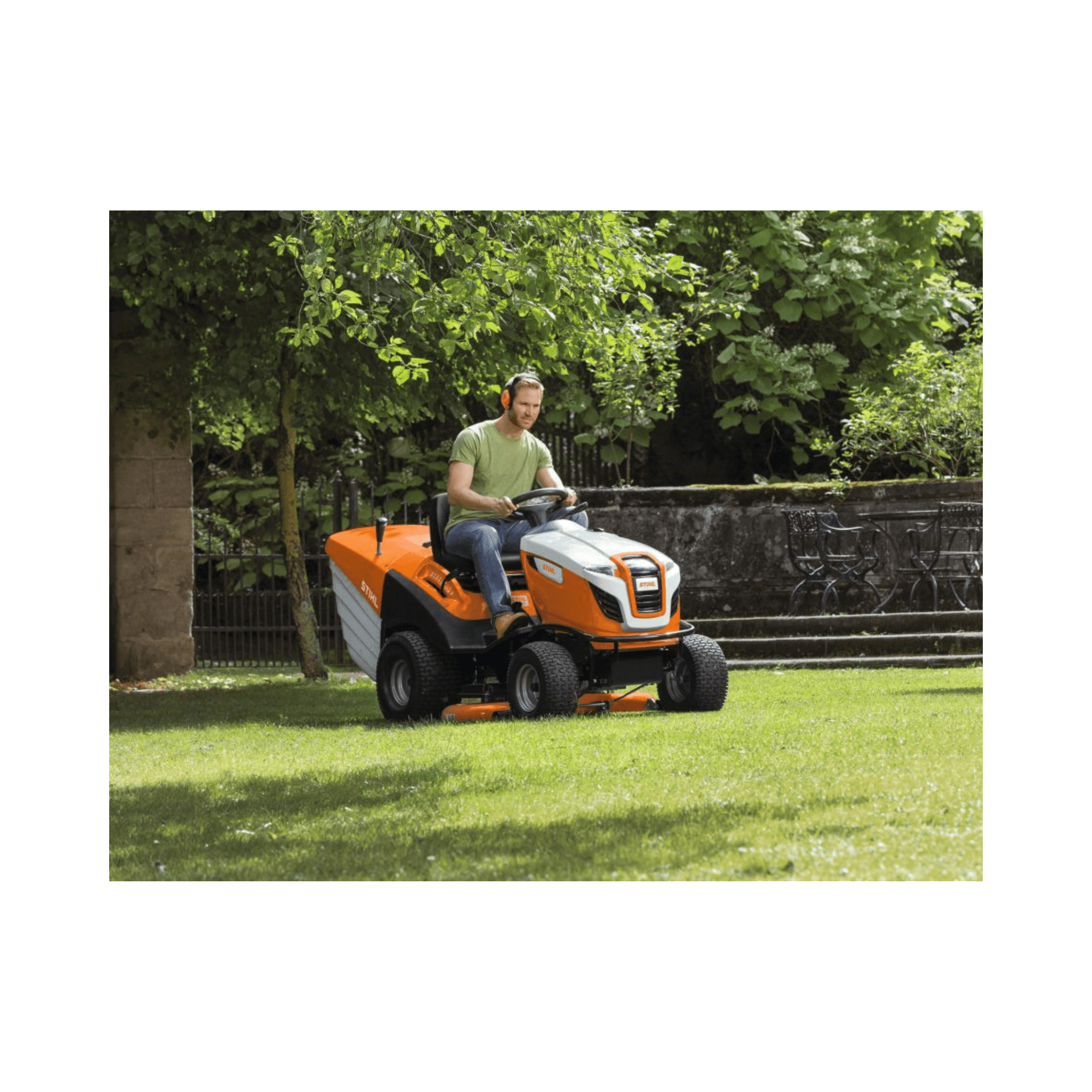 RT 6127 ZL 6 Series Petrol Ride on Lawn Mower in use on a green lawn by a man.