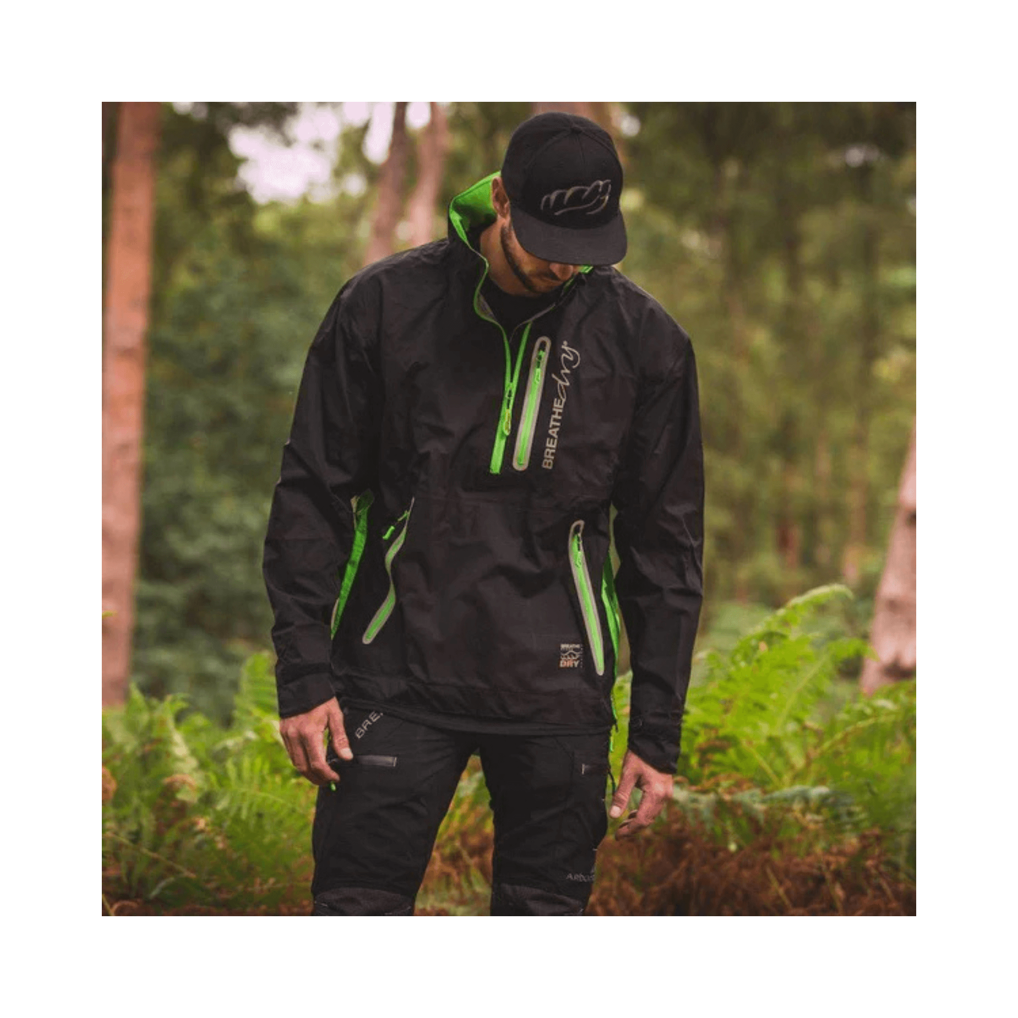 Breathedry Waterproof Smock worn by a tree surgeon in a forest setting, showcasing its lightweight and waterproof design.