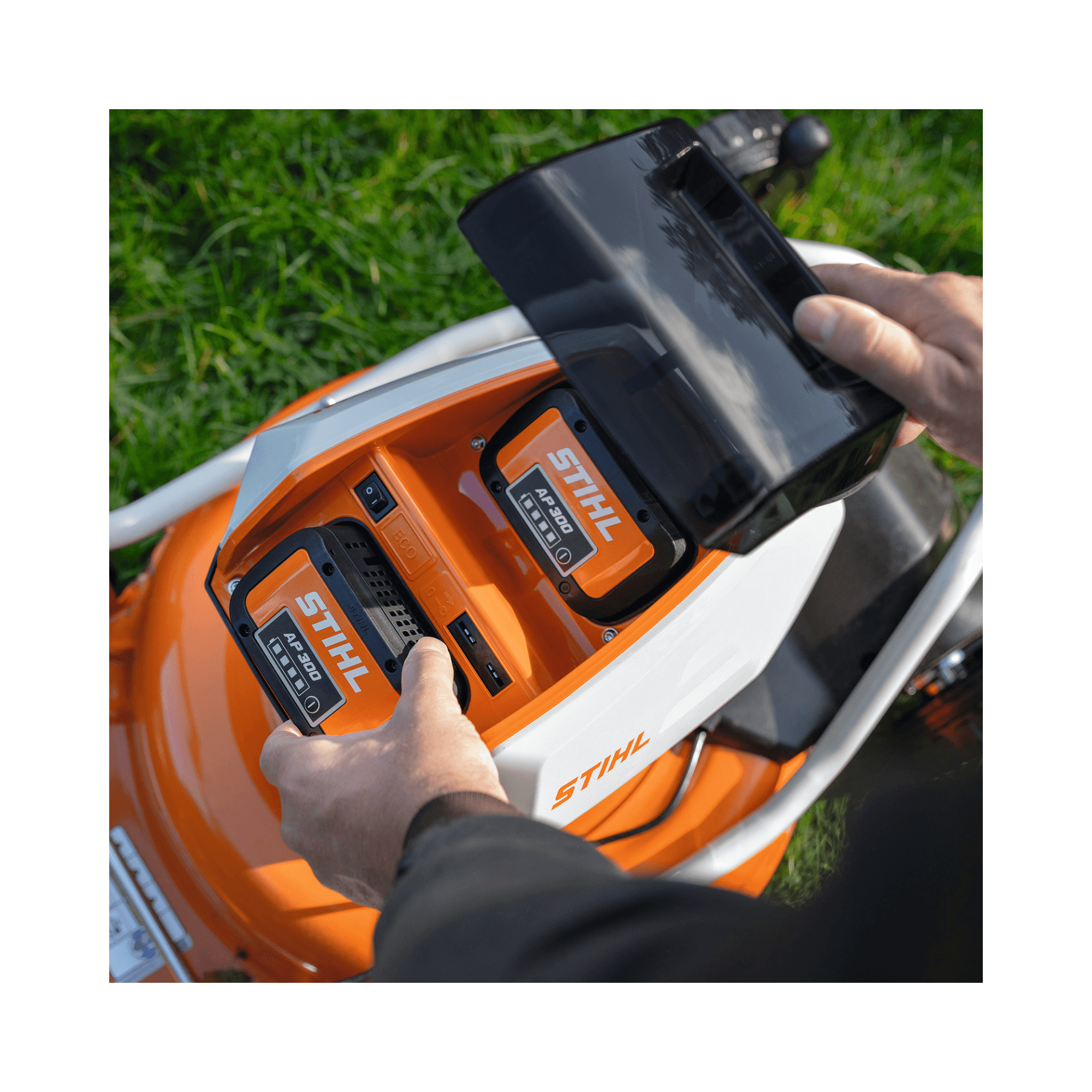 Close-up of the battery compartment of the RMA 2 RV Cordless Mulching Lawnmower showing battery installation.