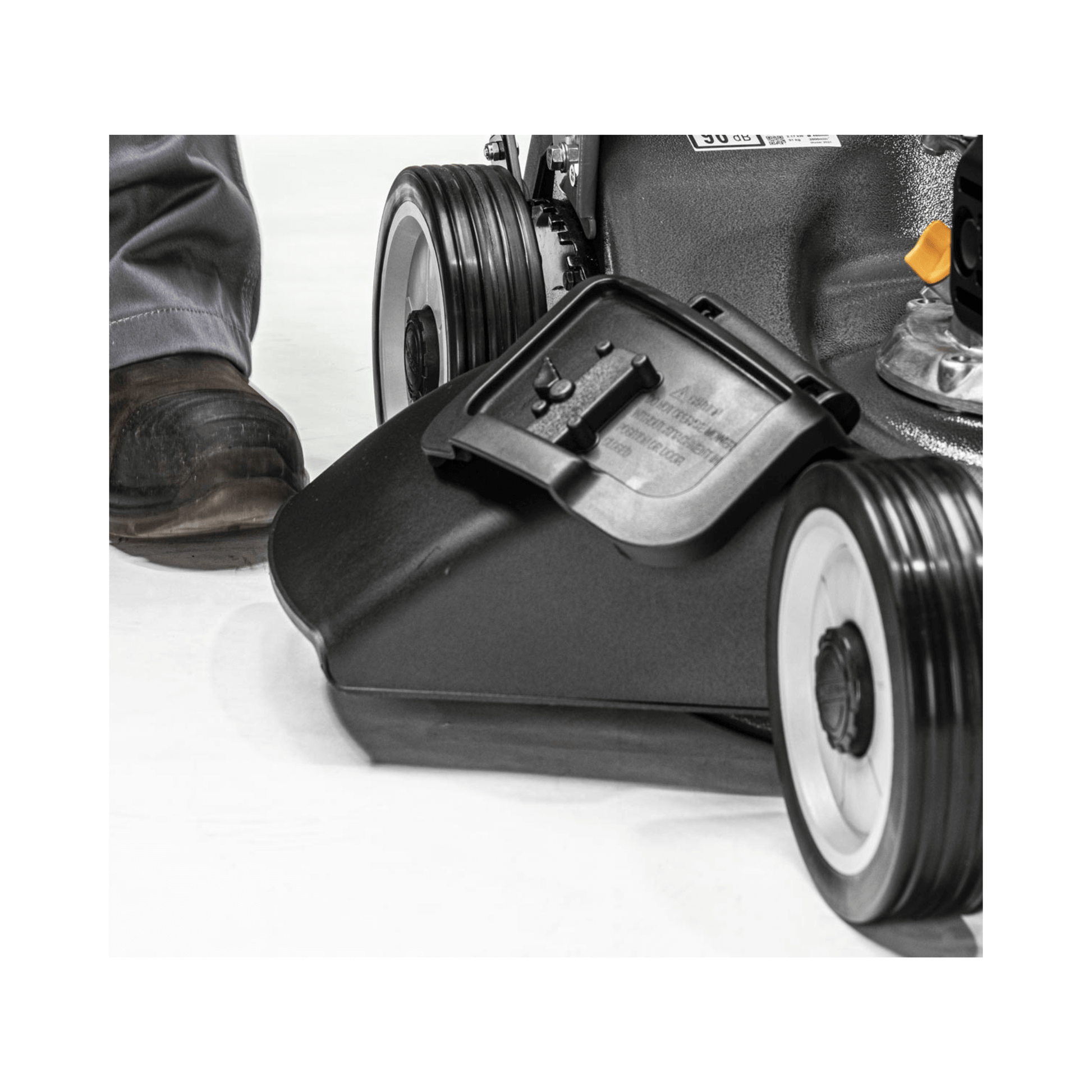 Close-up of the cutting deck and wheels of the Virtue 50 SVP-H Variable Speed Petrol Lawnmower.