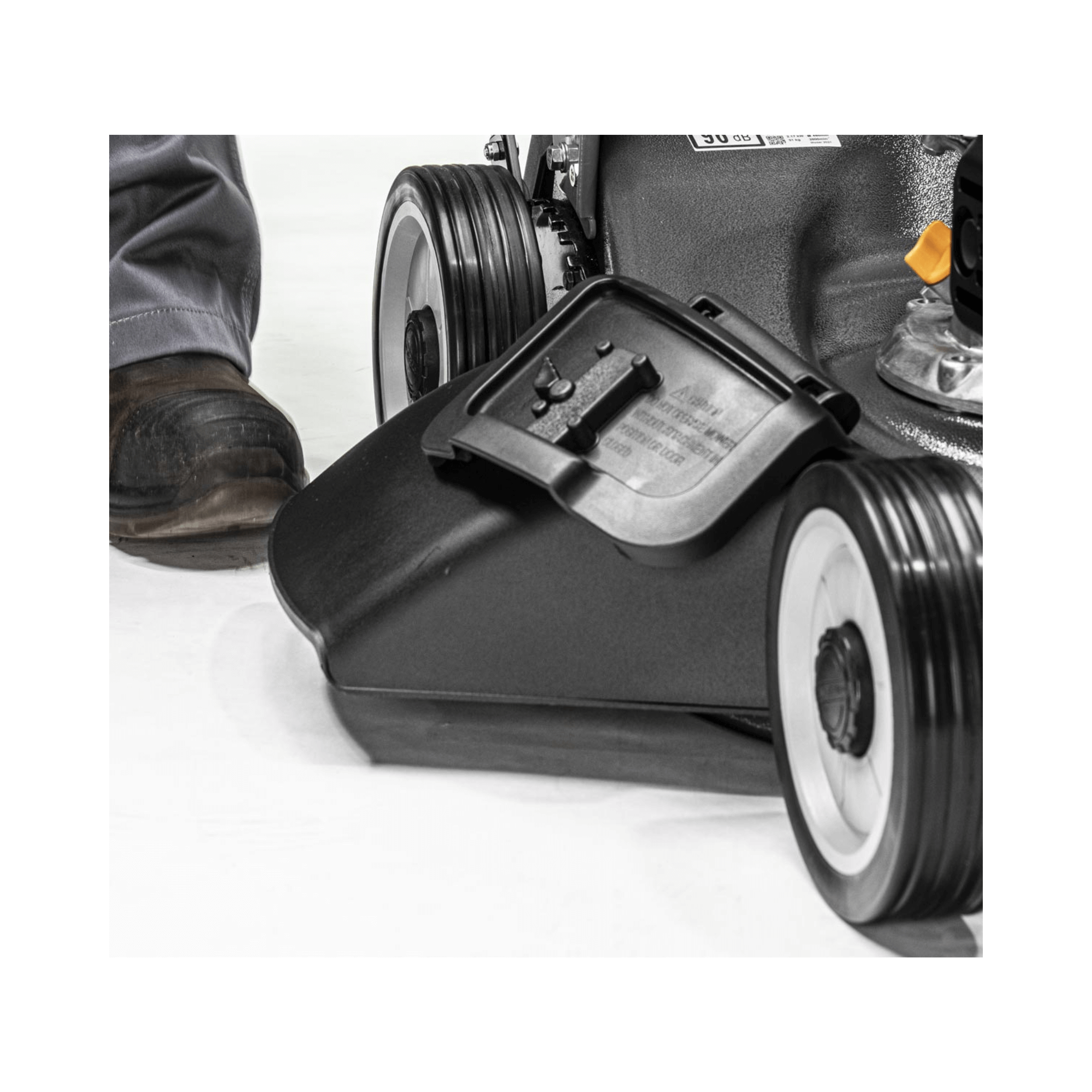 Close-up of the cutting deck and wheels of the Virtue 50 SVP-H Variable Speed Petrol Lawnmower.