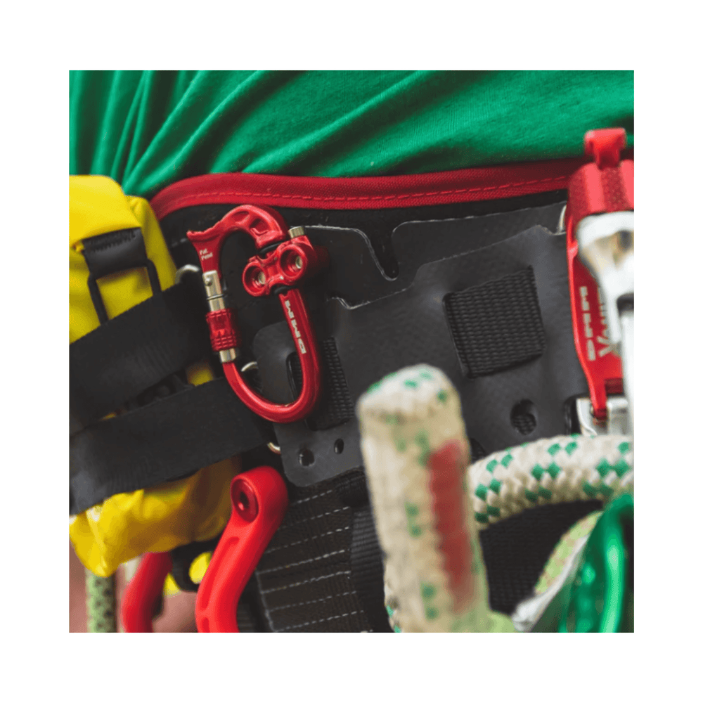 Micro Vault Tool Holder attached to a climbing harness with carabiners and ropes.