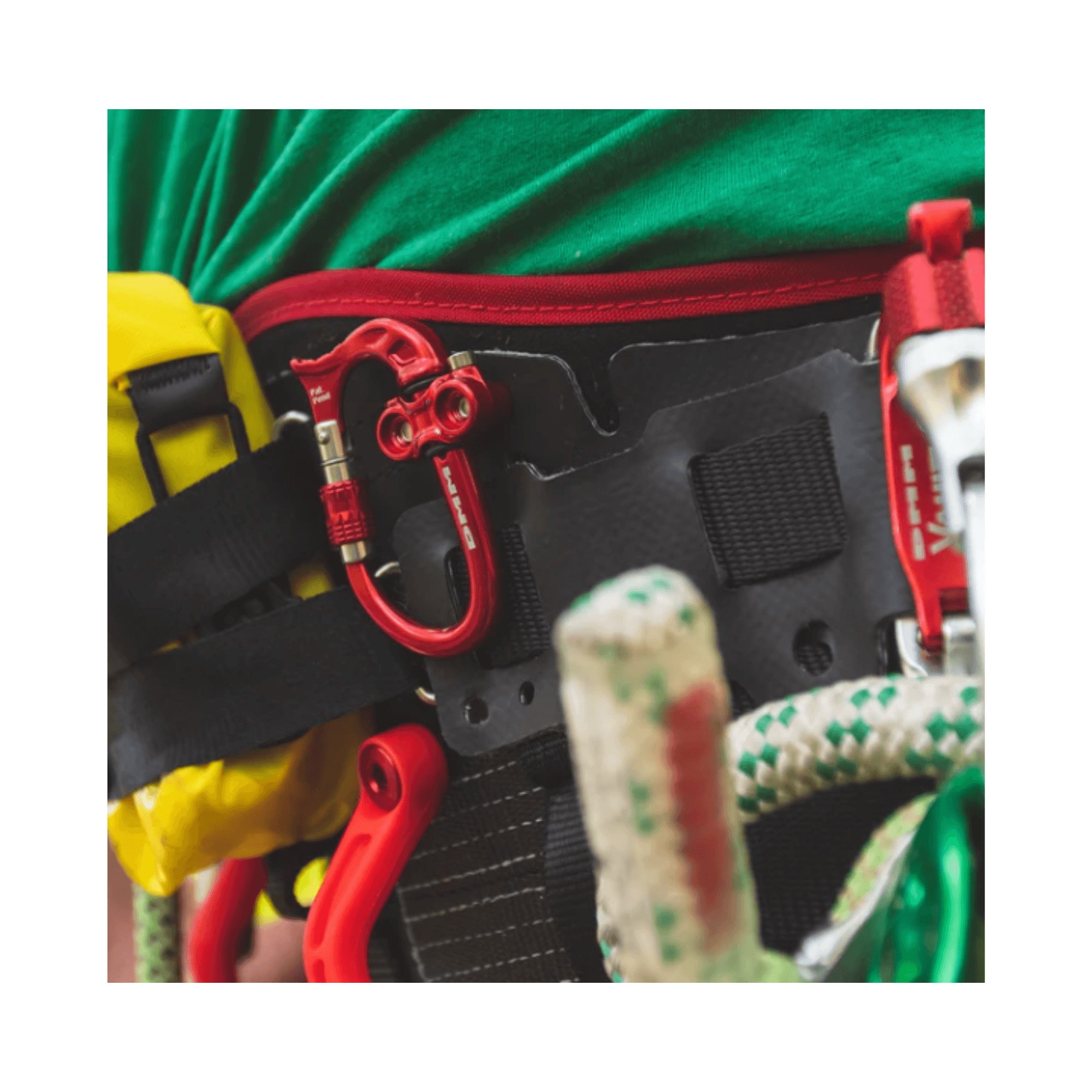 Micro Vault Tool Holder attached to a climbing harness with carabiners and ropes.