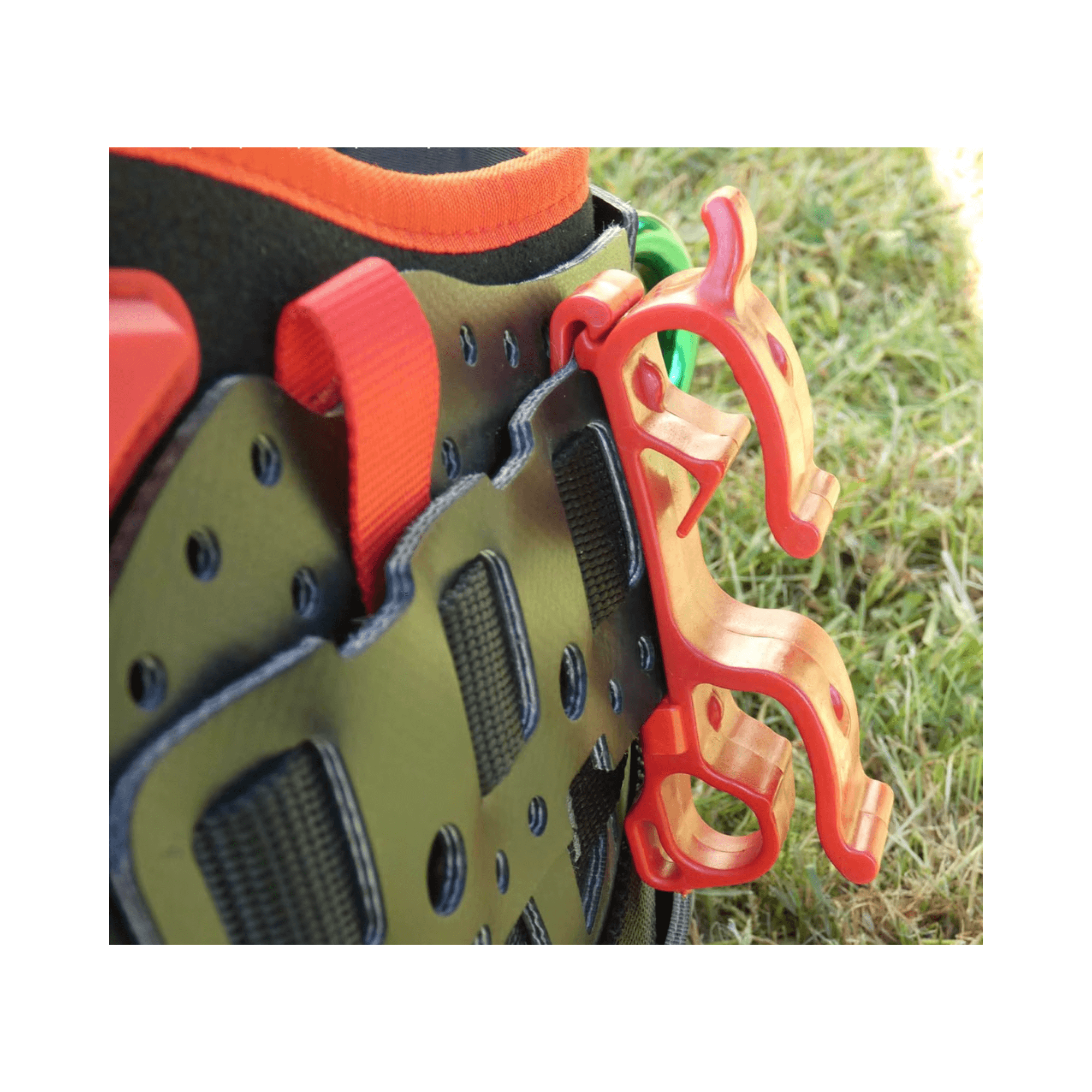 Close-up of Arbpro Buddy Lanyard Manager attaching to a harness for efficient rope management.