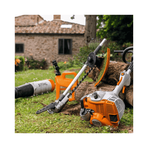 STIHL KM 56 RC-E Petrol KombiEngine and attachments in a garden setting for tree maintenance.