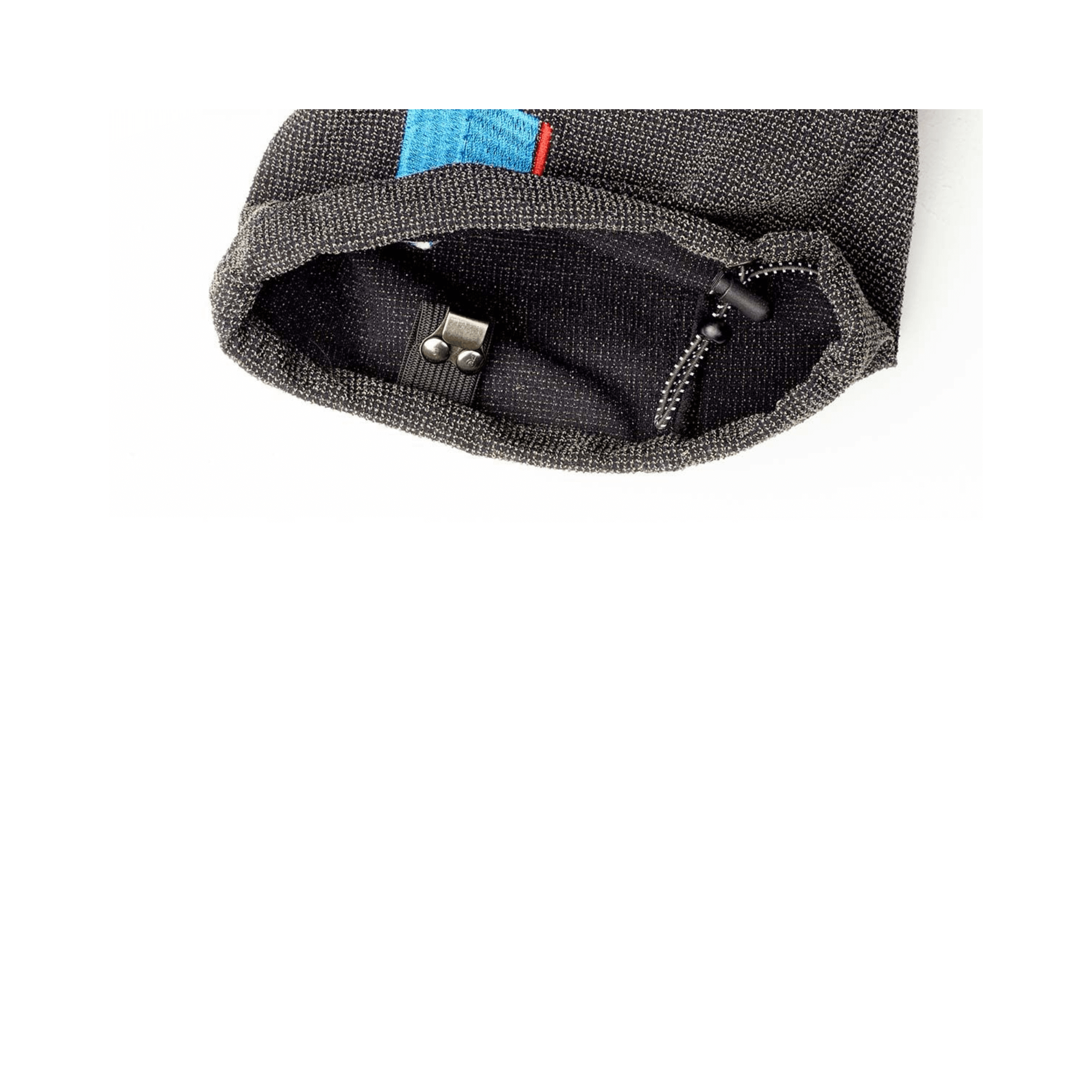 Close-up of the opening of the Way Up Light Climbing Pants showcasing quality stitching and adjustable toggle.