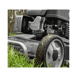 Close-up of WEIBANG Virtue 53 ASD LV Self Propelled Petrol Lawnmower engine and wheel design in grass.