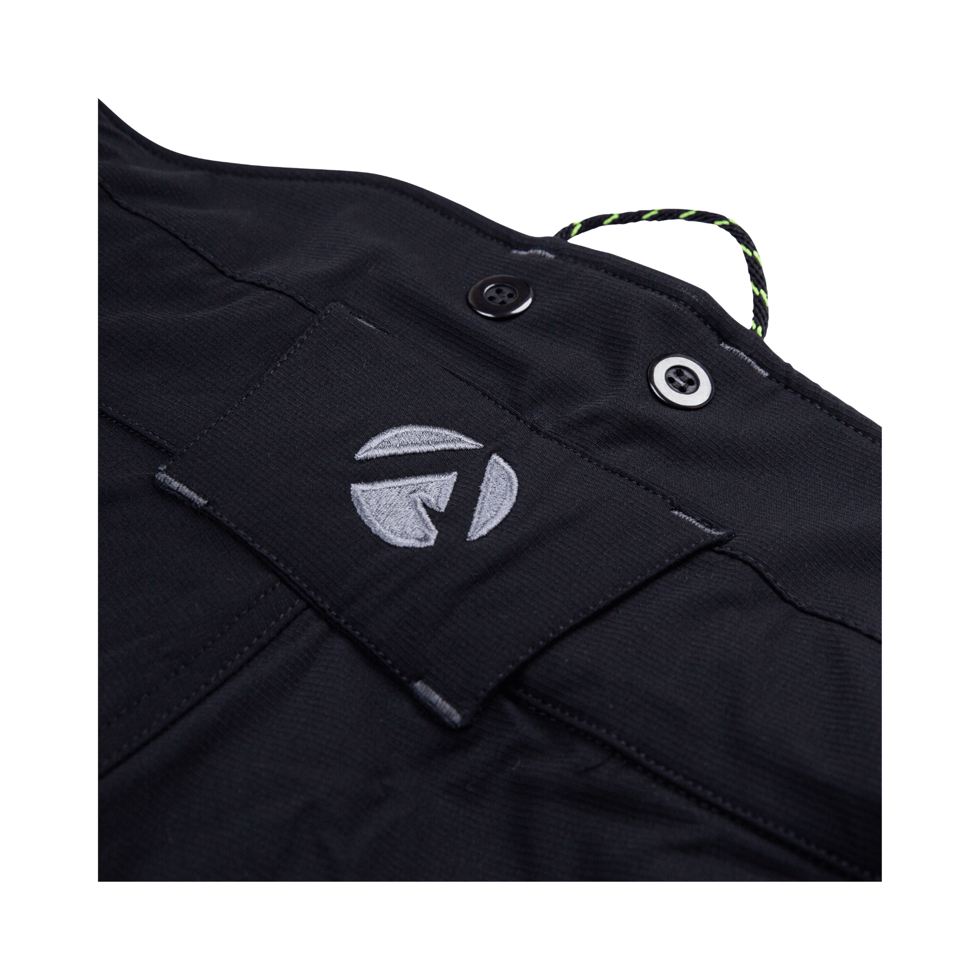 Close-up of the waistband label on Vented Chainsaw Trousers Type A, showcasing the brand logo and button details.