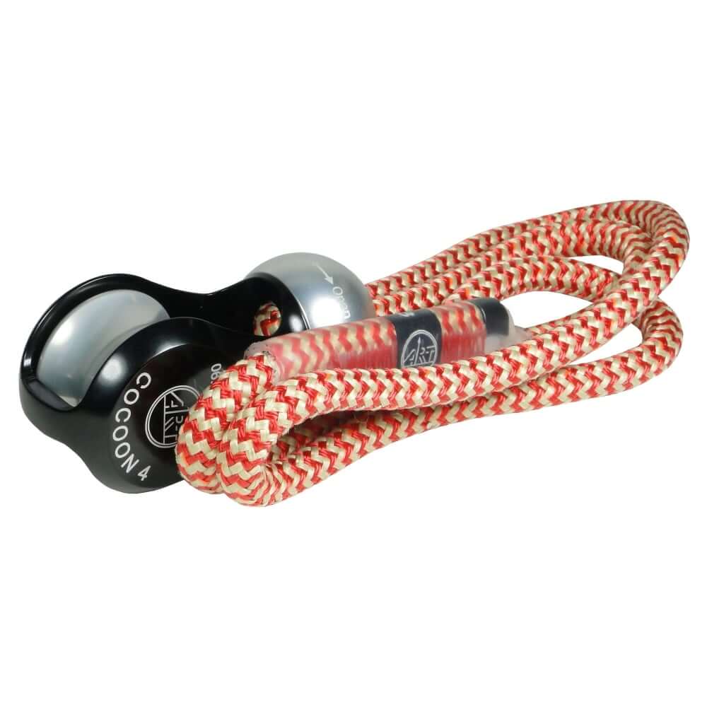 A Cocoon climbing protection device with a red and white rope threaded through its pulley system.