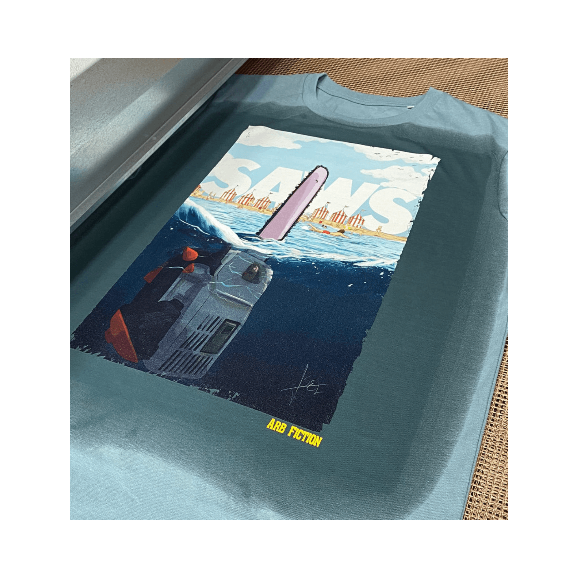 Saws T-Shirt featuring a graphic design inspired by the Jaws movie poster with a chainsaw and humorous text.