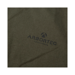 Close-up of the Arbortec logo on the Short Sleeve T-Shirt Olive, showcasing quality cotton fabric.