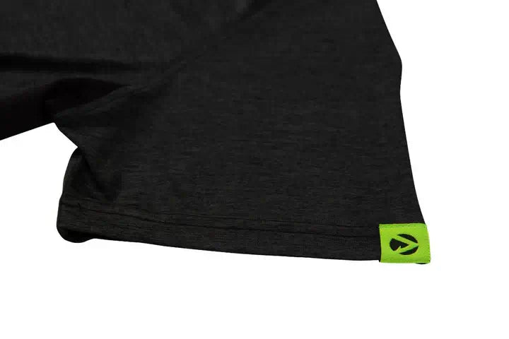 Close-up of Arbortec black performance t-shirt sleeve with green logo tag, ideal for tree surgeons and activewear.