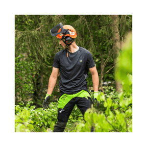 Breatheflex Chainsaw Trousers Black/Lime Type C Class 2 worn by a tree surgeon in green foliage.
