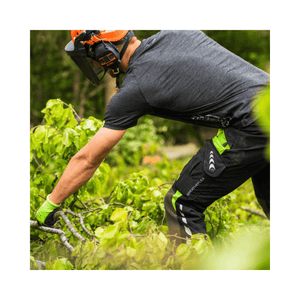 Breatheflex Chainsaw Trousers Black/Lime Type C Class 2 worn by tree surgeon while working in the forest.