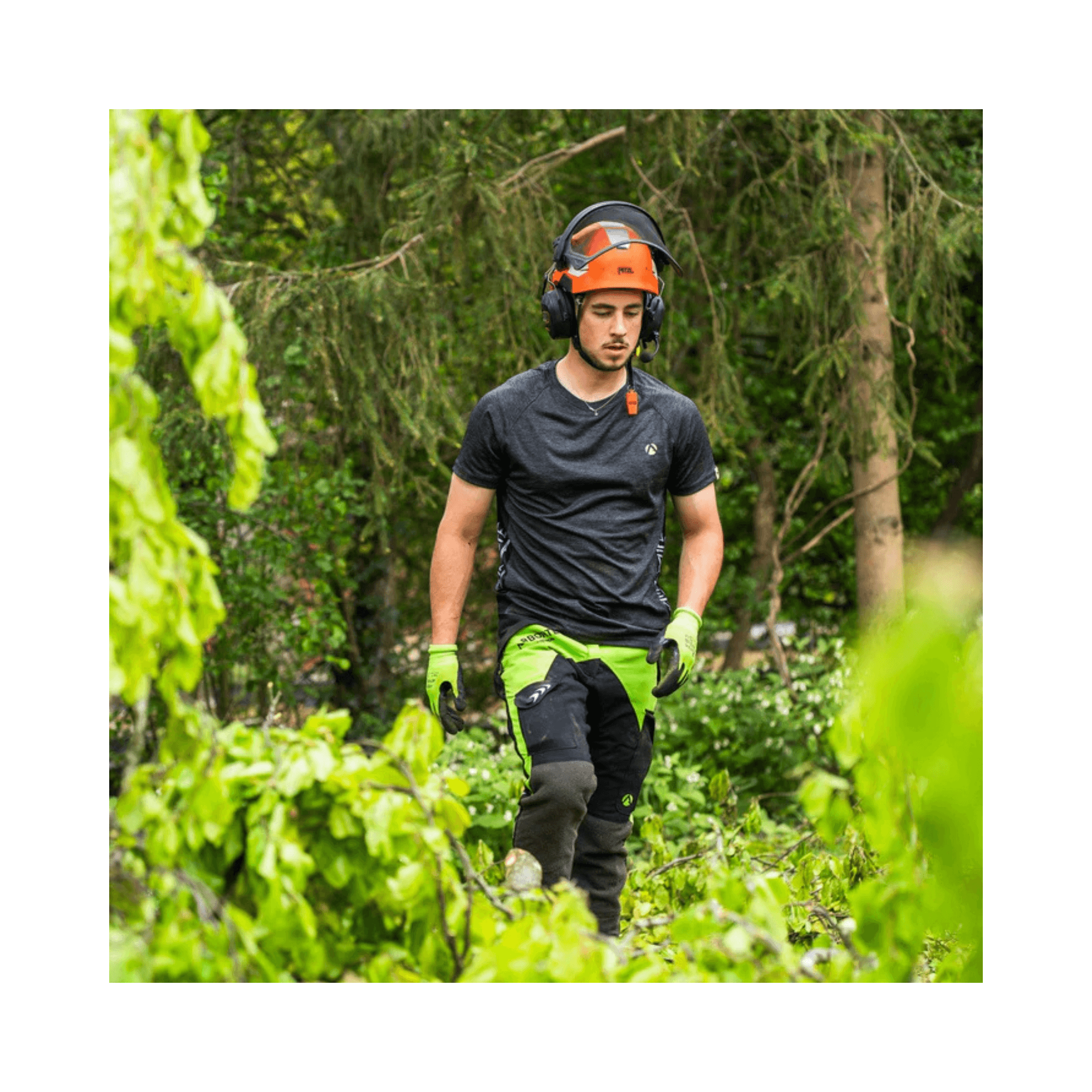 Breatheflex Chainsaw Trousers Black/Lime Type C Class 2 being worn by a tree surgeon in a forest.