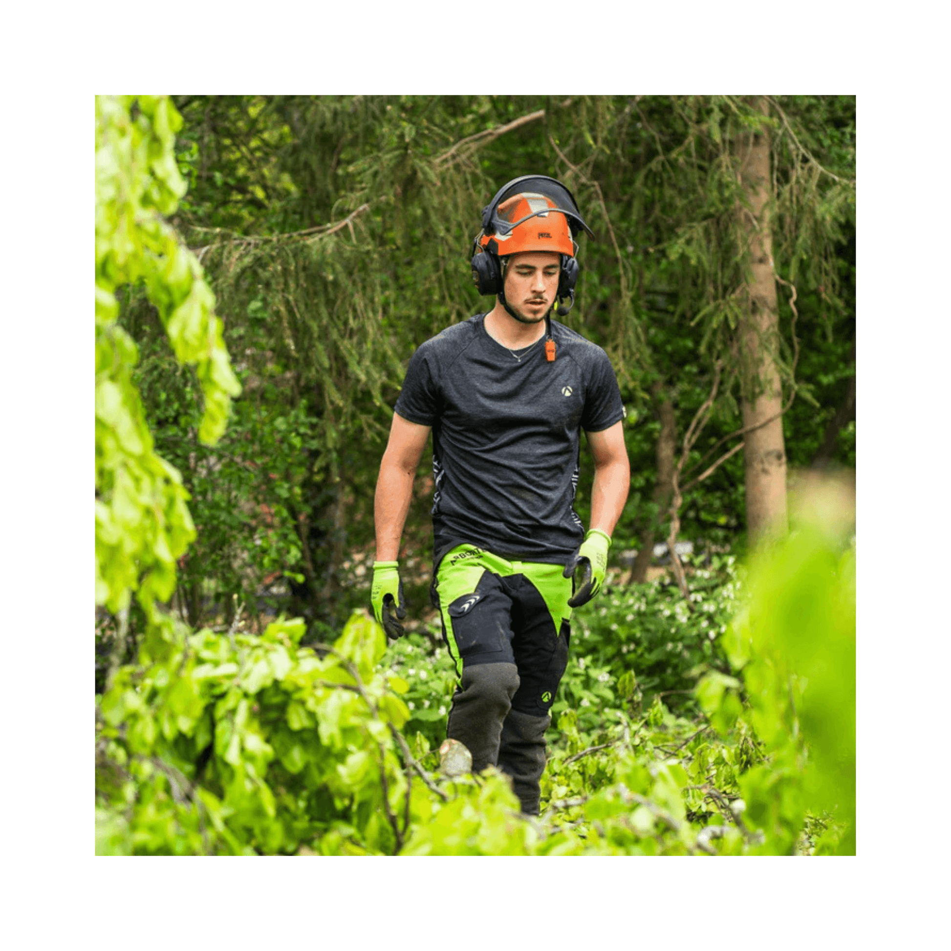 Breatheflex Chainsaw Trousers Black/Lime Type C Class 2 being worn by a tree surgeon in a forest.
