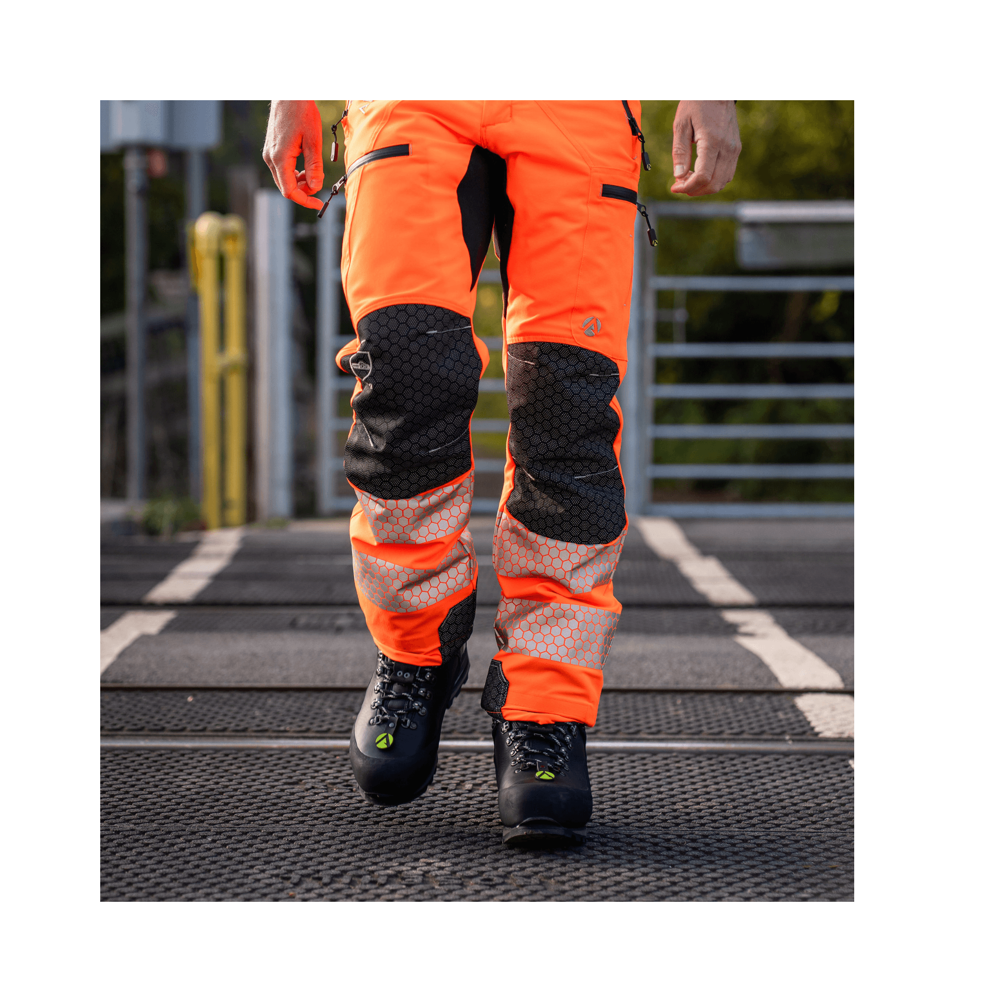 Breatheflex Pro Rail Spec Trousers Design Type C Class 2 Hi Viz Orange being worn by a worker.