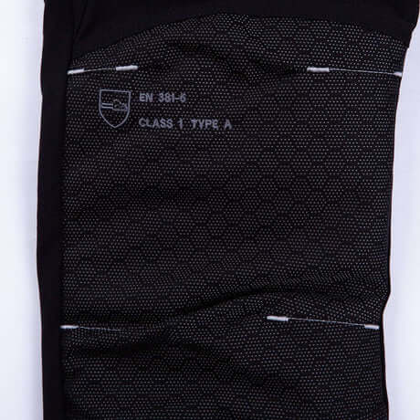 Close-up of Arborist chainsaw trousers showing EN 381-6 certification details for Type A protection.