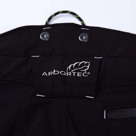 Close-up of the Arbortec logo on Breatheflex Pro Freestyle Chainsaw Trousers designed for tree surgeons.