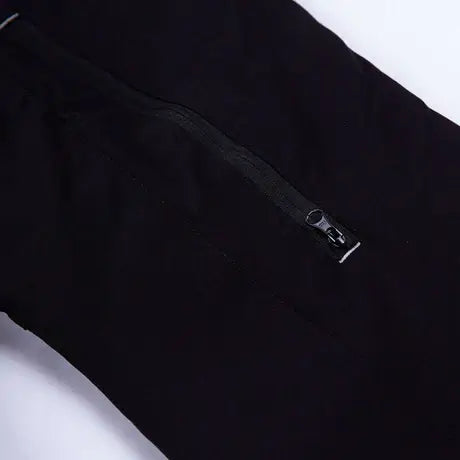 Close-up of the zippered pocket on Breatheflex Pro Freestyle Chainsaw Trousers for tree surgeons.