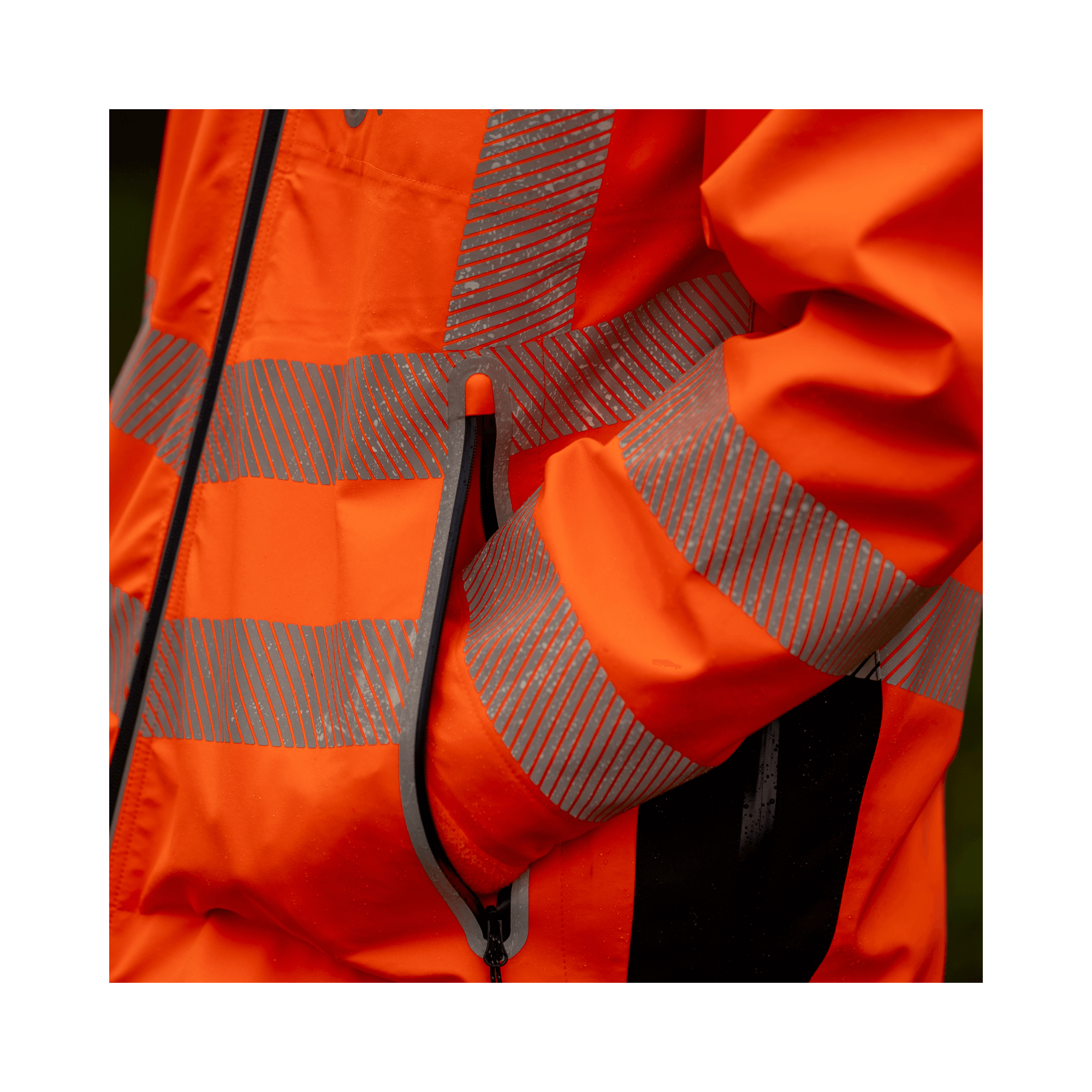 Full Zip Waterproof Work Jacket Hi-Vis Orange detail showing reflective stripes and pocket.