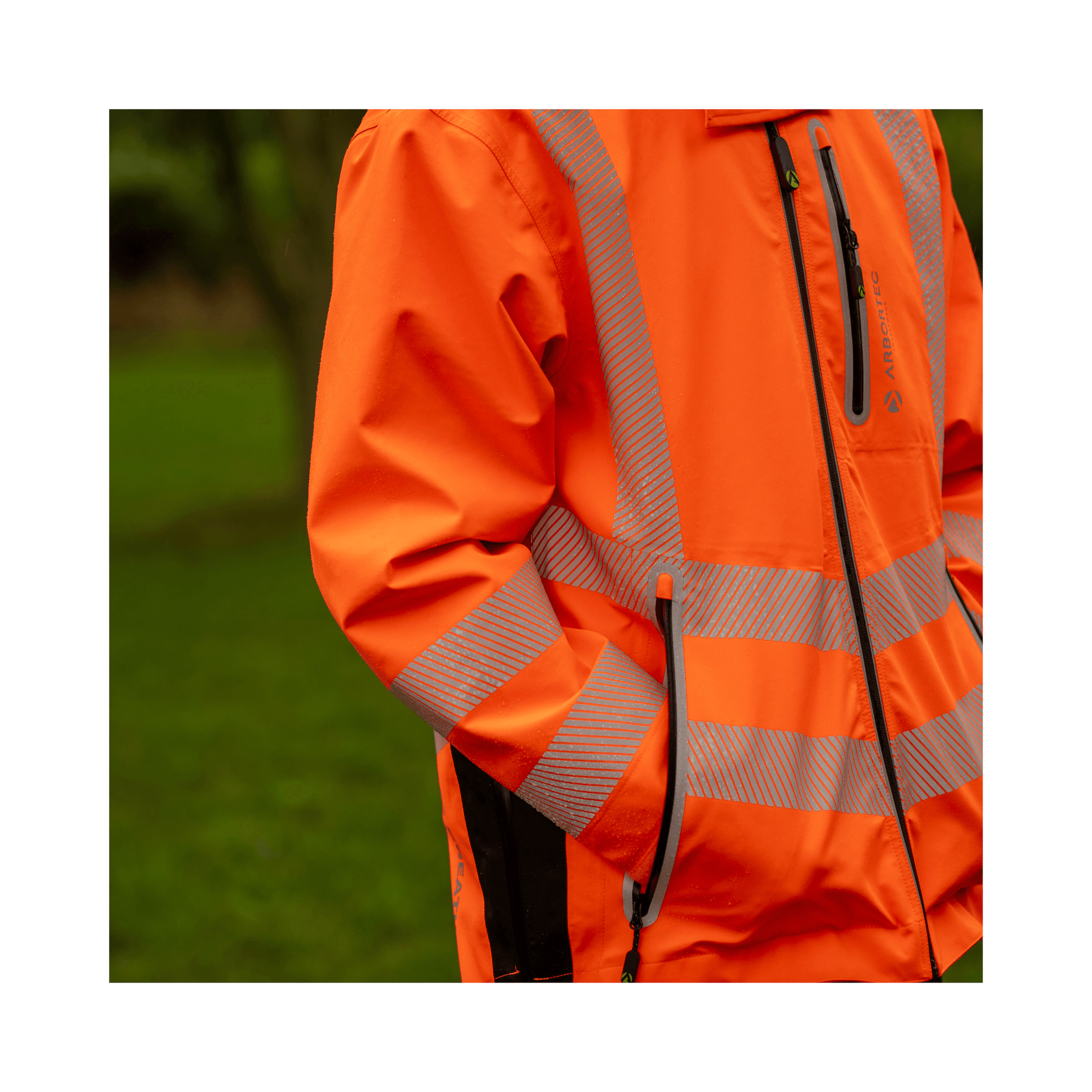 Full Zip Waterproof Work Jacket Hi-Vis Orange in action outdoors, showcasing vibrant color and reflective stripes.