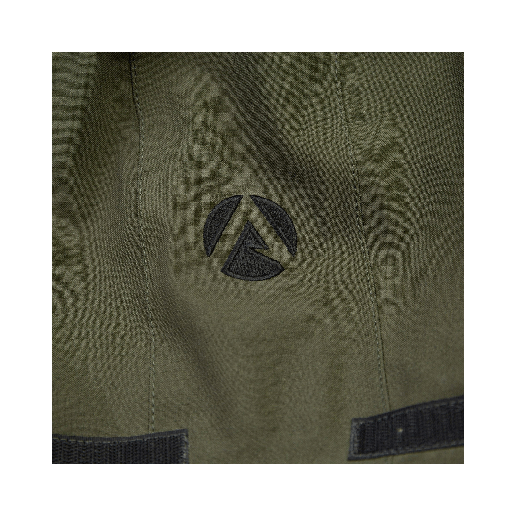 Close-up of logo on Heavy Duty Full Zip Waterproof Jacket Olive by Arbortec, showcasing durability and quality.