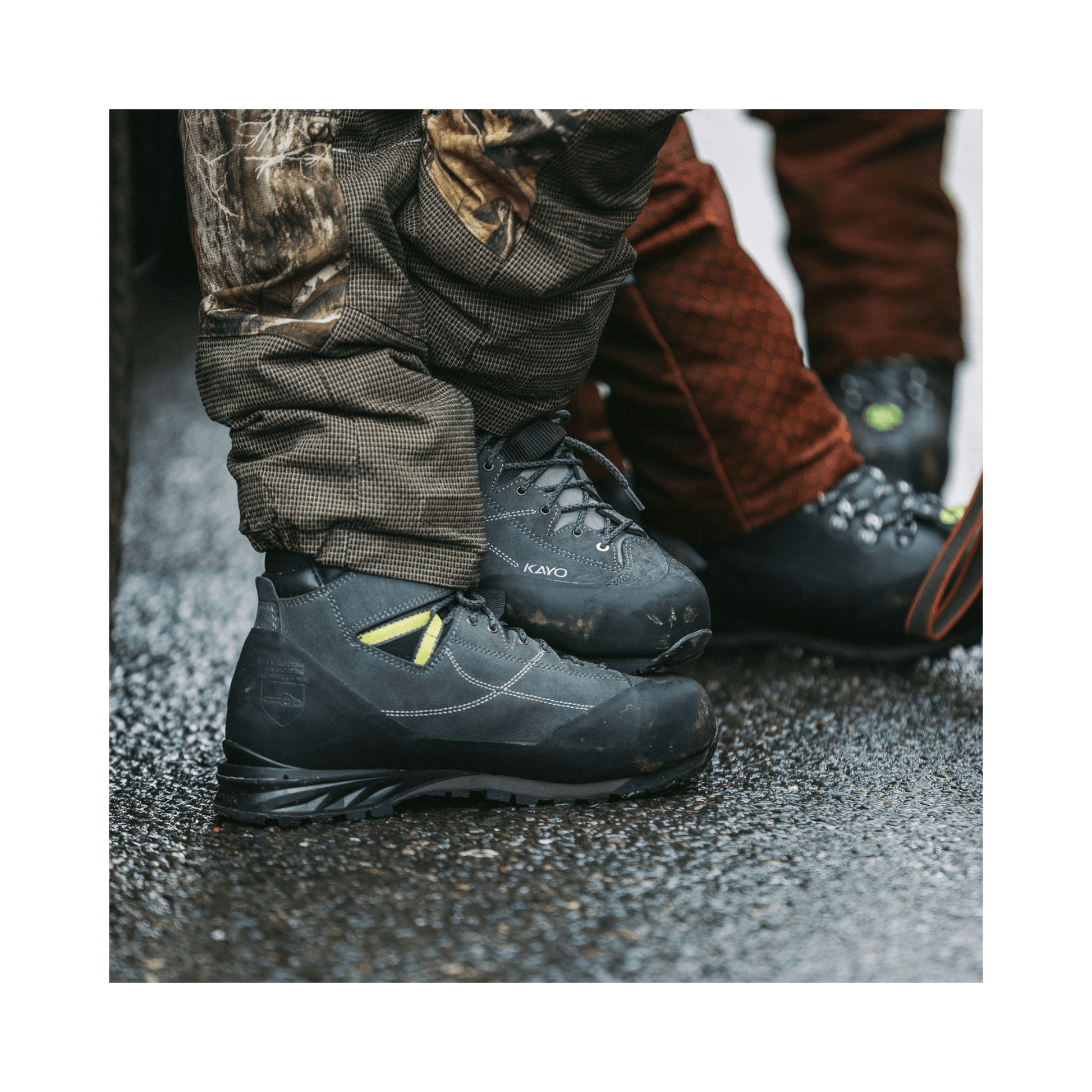 Kayo Chainsaw Boots Class 2 worn by tree surgeons on a wet surface during climbing work.