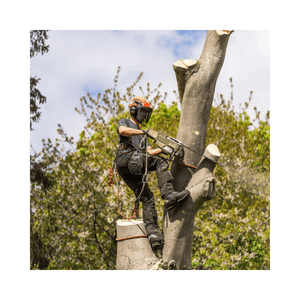 Tree surgeon using a chainsaw while wearing a Performance T-Shirt Short Sleeve and safety gear in a tree.