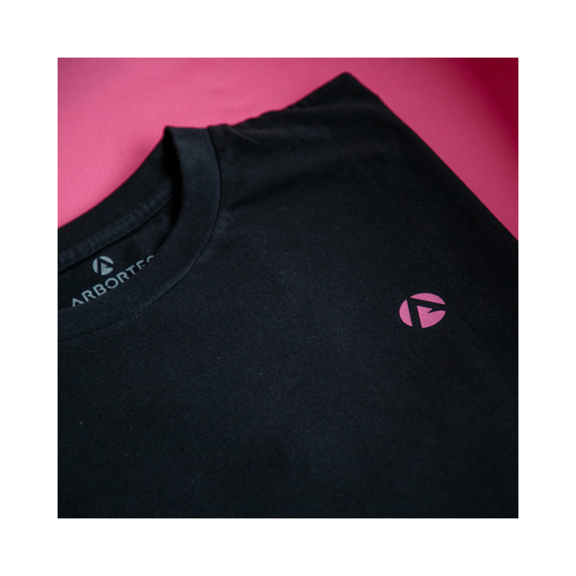 Short Sleeve T-Shirt Black featuring a pink Arbortec logo on a black fabric, perfect for casual or professional wear.