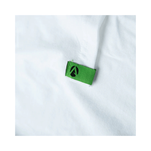 Close-up of the label on the Arbortec Short Sleeve T-Shirt White, featuring a green tag with the Arbortec logo.