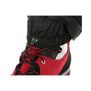 Climbtech Gamma Chainsaw Trousers Black Type A close-up detail of ankle cuff with red footwear.