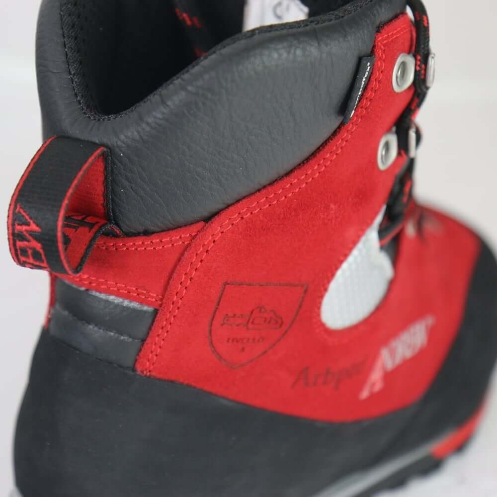 Close-up of Arbpro Cervino Wood red chainsaw boots designed for tree surgeons, showcasing no metal hooks and durable material.